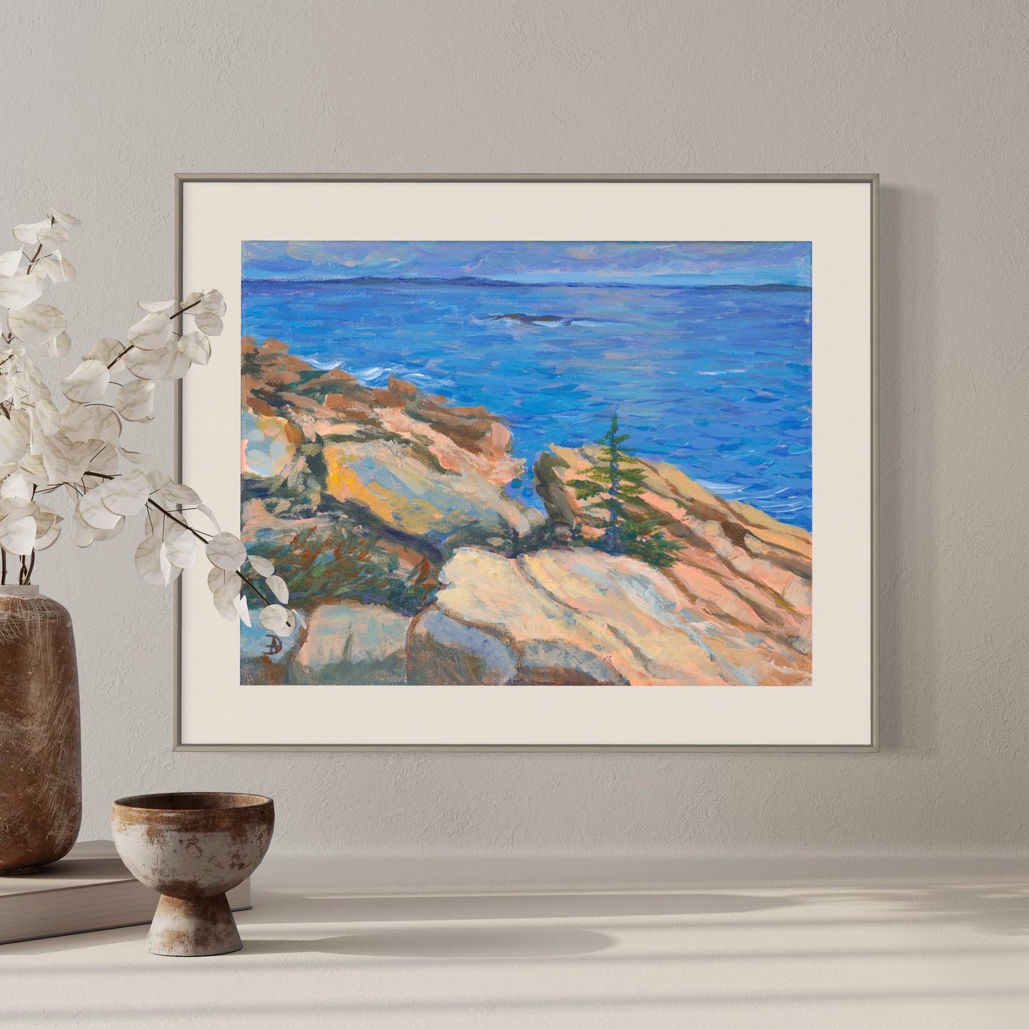 Close-up interior with an acrylic painting depicting a seascape with sunny rocks and the Atlantic ocean at the Acadia National Park, by Andreea Dumez