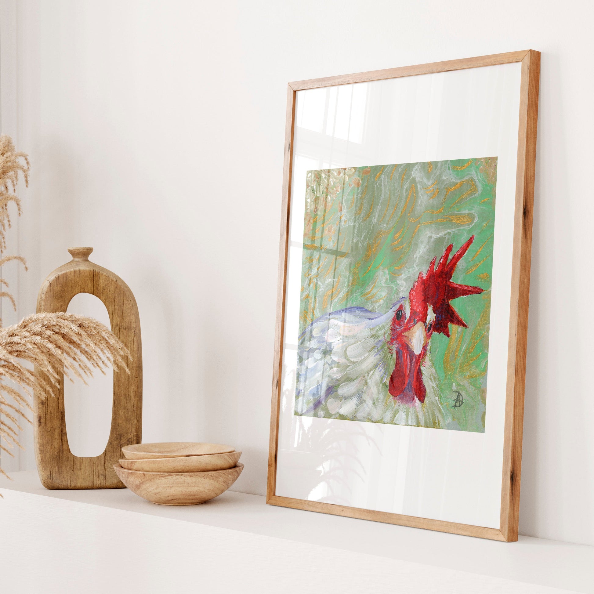 Framed display of a painting of a white rooster looking straight at the viewer