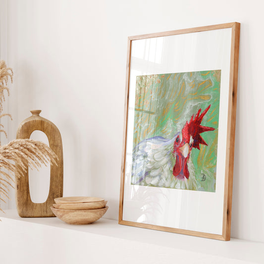 Framed display of a painting of a white rooster looking straight at the viewer